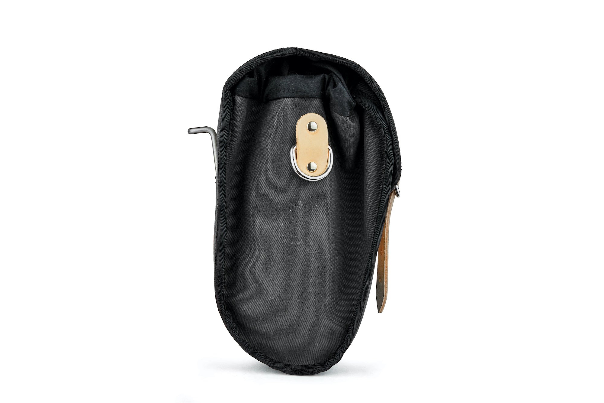 Side view of Frost and Sekers Marvin saddle bag. Black canvas with tan leather.